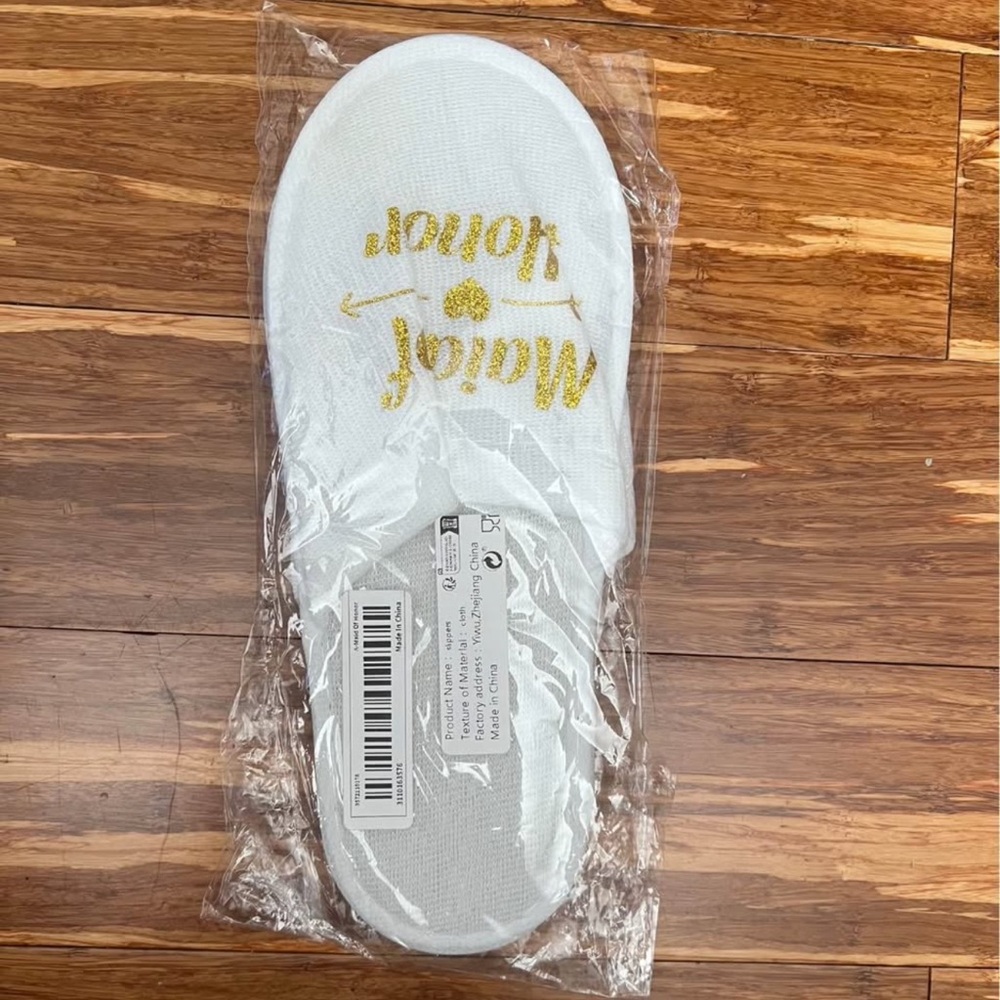 White Slippers with Gold Text
